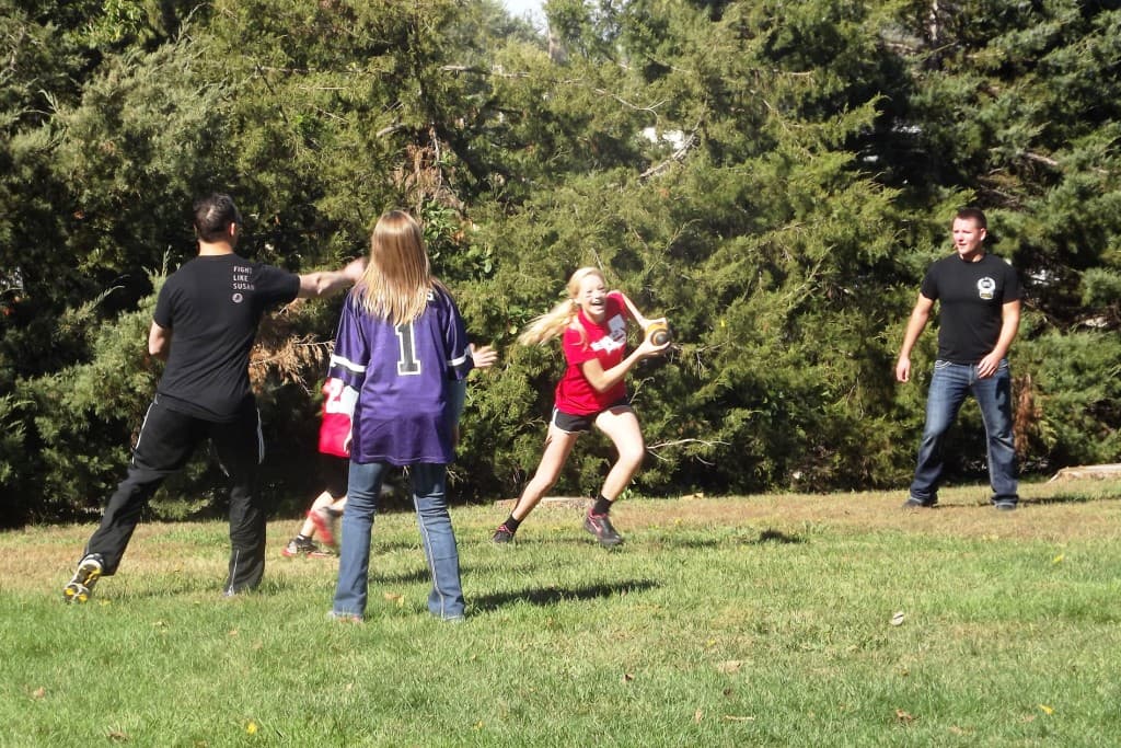 Family playing ball on the grounds