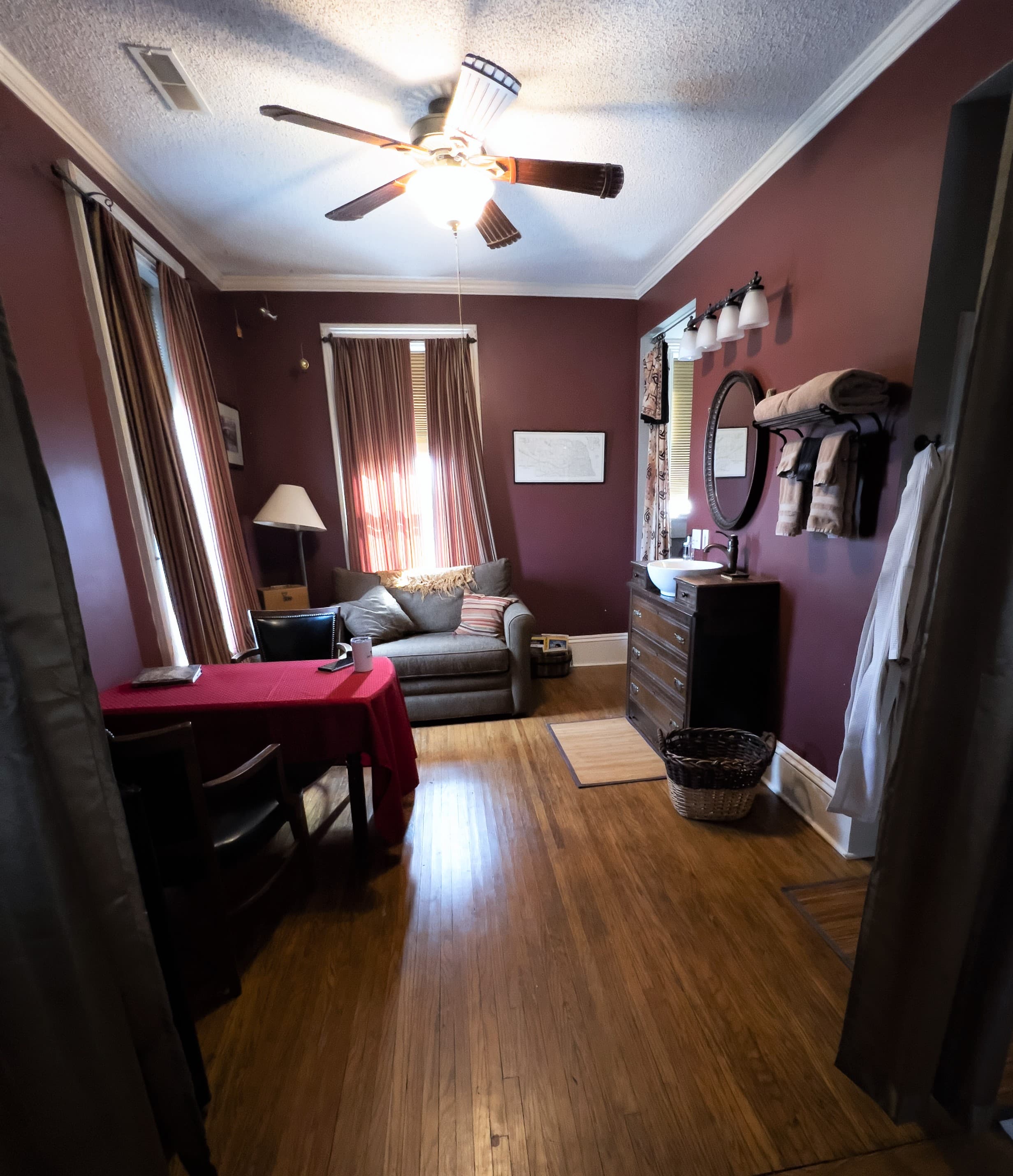 Comfortable sitting area features an oversized chair that converts to a twin sleeper for an extra guest