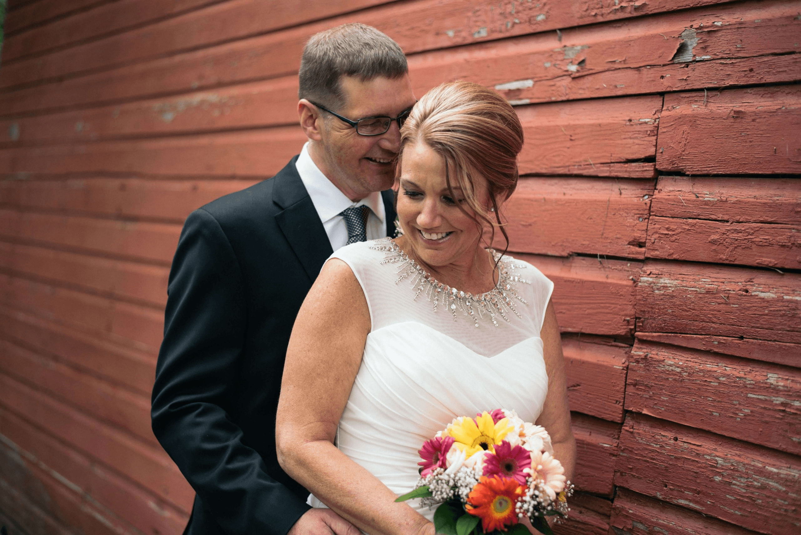 Bride and groom holding each other