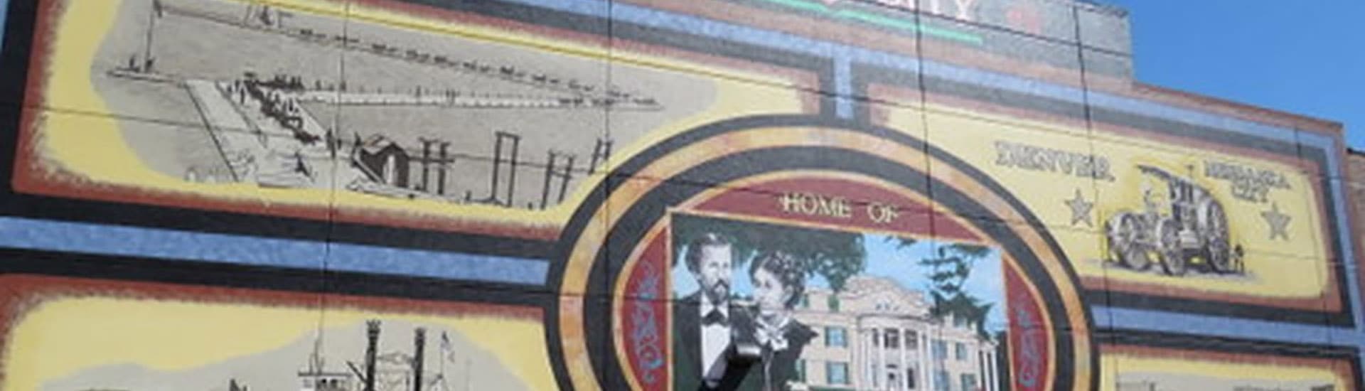 A colorful mural depicting historical scenes and landmarks.