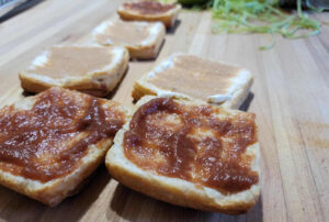 Apple butter spread on split croissants before baking